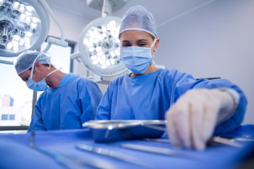 a group of surgeons in a operating room