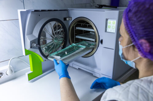 Person using a sterilization machine